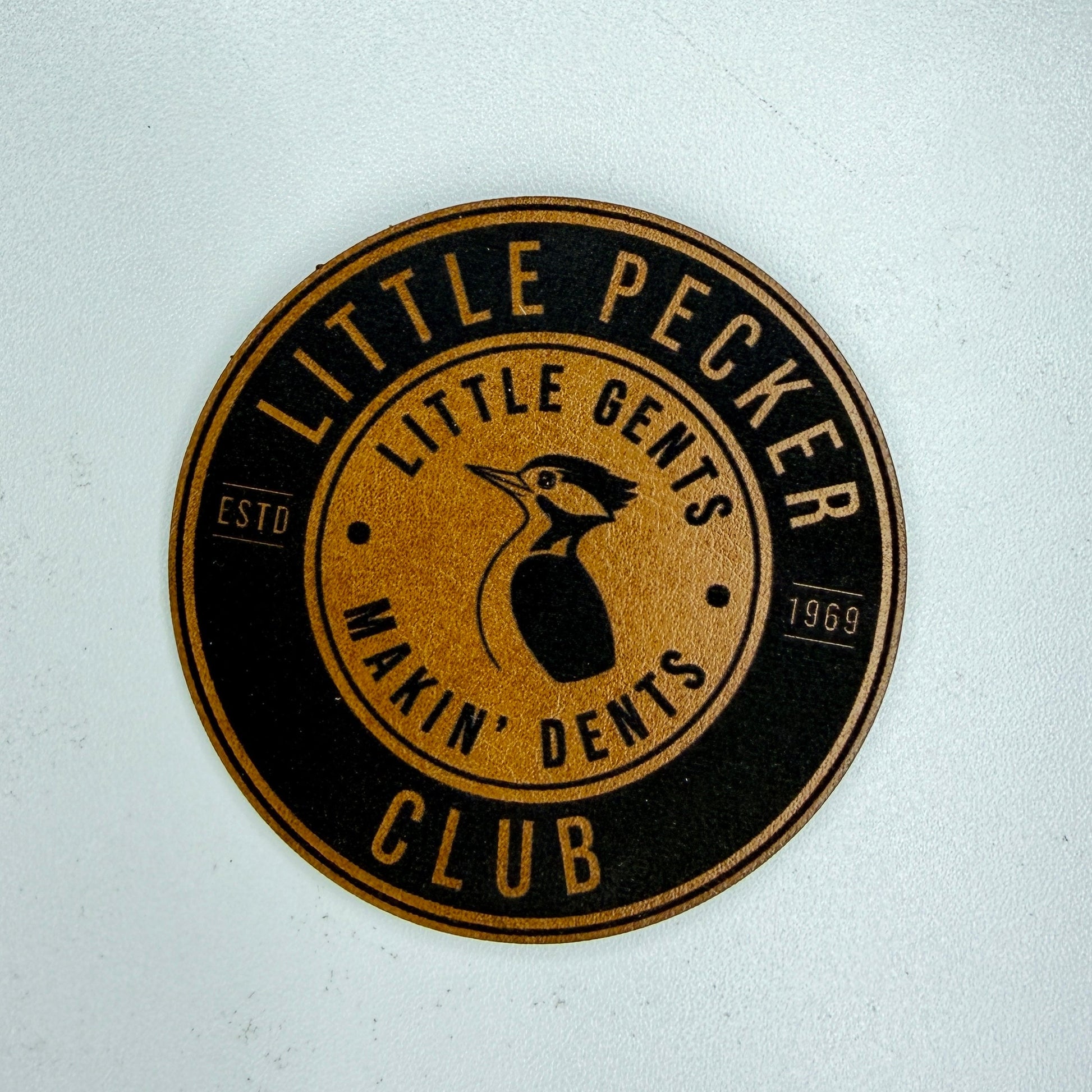 Circular logo with 'Little Pecker' text on a white background