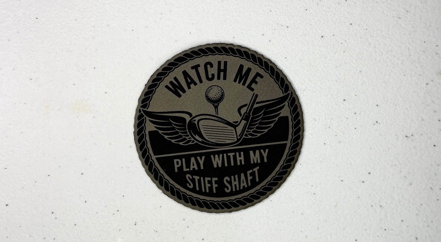 Round black patch with text and graphics on a white background
