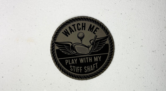 Round black patch with text and graphics on a white background